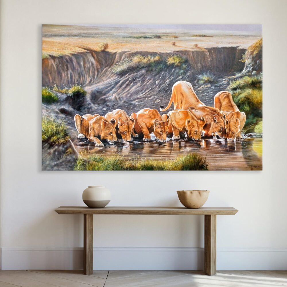 A wall-mounted, hand-painted piece of art of a group of lions drinking water in the wild - By Daniel Njoroge