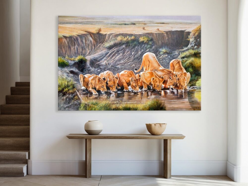 A wall-mounted, hand-painted piece of art of a group of lions drinking water in the wild - By Daniel Njoroge